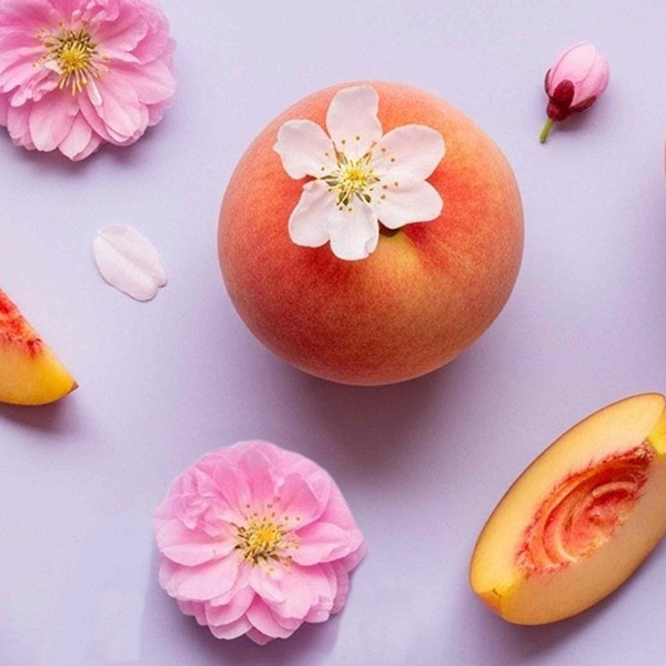 Profile picture showing peaches and white and pink flowers.